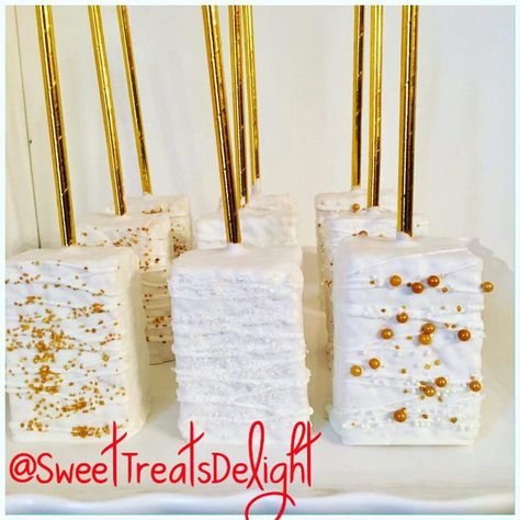 Rice Krispie Treats covered inWhite Chocolate with Gold accents Chocolate Covered Rice Krispie Treats Wedding, Rice Krispy Treats Chocolate Covered, White And Gold Rice Krispie Treats, Fancy Rice Krispie Treats Wedding, Wedding Rice Krispie Treats Ideas, Rice Crispy Dipped In Chocolate, Chocolate Rice Krispie Treats Dipped, Rice Crispy Treat Pops, Gold And White Treats