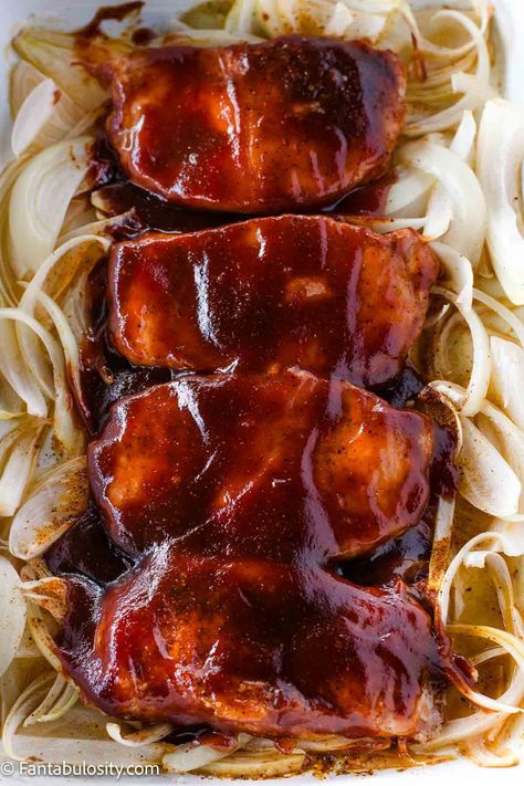 BBQ sauce covered pork chops on a plate with onions. Baked Pork Chops Recipes, Baked Bbq Pork Chops, Pork Chops In The Oven, Pork Chops Recipes, Bbq Pork Loin, Baked Boneless Pork Chops, Bbq Pork Chops, Pork Chop Recipes Baked, Boneless Pork Chops