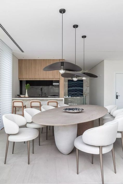 a beautiful minimalist dining room with an oval table and rock legs, creamy curved chairs, black pendant lamps Dinning Table Set, Minimalist Dining Room, Dinning Room Design, Dinner Room, Luxury Dining Room, Dining Sets Modern, White Table Cloth, Luxury Dining, Dining Room Inspiration