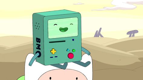 This is BMO, a character on the cartoon Adventure Time by Pendleton Ward. BMO is a cube with cylindrical limbs and an iconic face. He also features circular and rounded rectangular buttons and slots. The fact that BMO is made up of very simple shapes matches well with his happy, carefree personality on the show. But, its kind of interesting to me that although his design is very simple, it kind of contrasts with the very complex and technical tasks that BMO can perform. Bmo Adventure Time Icon, Bmo Adventure Time Profile Picture, Cute Animated Characters, Bmo Icon, Bmo Skateboard Tattoo, Bmo Adventure Time Sitting, Diy Backyard Movie Night, Finn Adventure Time Screenshots, Adventure Time Tattoo