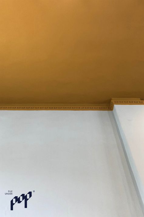 The ceiling is painted in 'Mean Mustard'. Mustard Ceiling Bedroom, Mustard Yellow Ceiling, Mustard Ceiling Paint, Pale Mustard Walls, Mustard Yellow Feature Wall, Painted Ceiling Yellow, Mustard Ceiling, Yellow Ceiling, Climbing Wall