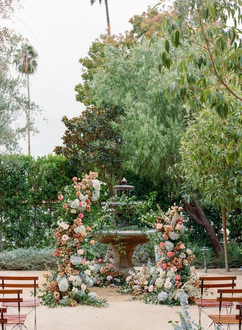 Spanish Garden Wedding Theme, Garden Ceremony Backdrop, Wedding Ceremony In Front Of Fountain, Spanish Wedding Ceremony, Fountain Florals Wedding, Fountain Wedding Ceremony, Fountain Wedding Decor, Fountain Florals, Wedding Ceremony Backdrop Ideas