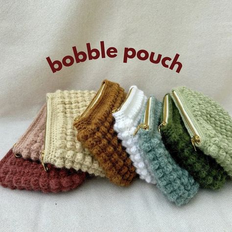 introducing the bobble pouch✨ these are perfect makeup bags or pencil pouches! They are going to be available on my etsy store in 8 different colors and lined with floral fabrics. Check them out in just 3 days!!! . . . #bobble #bobblestitch #smallbusiness #smallbusinessowner #bobblepouch #makeupbag #makeupbags #pencilpouch #pencilpouches #crochet #crochetlove #crochetaddict #etsy #etsyshop #etsyseller Crochet Bobble Pouch, Crochet Pouch With Zipper, Crochet Bobble Bag, Crochet Makeup Pouch, Makeup Bag Crochet, Crochet Pencil Pouch, Knitted Pouch, Granny Square Pouch, Crochet Zipper Pouch