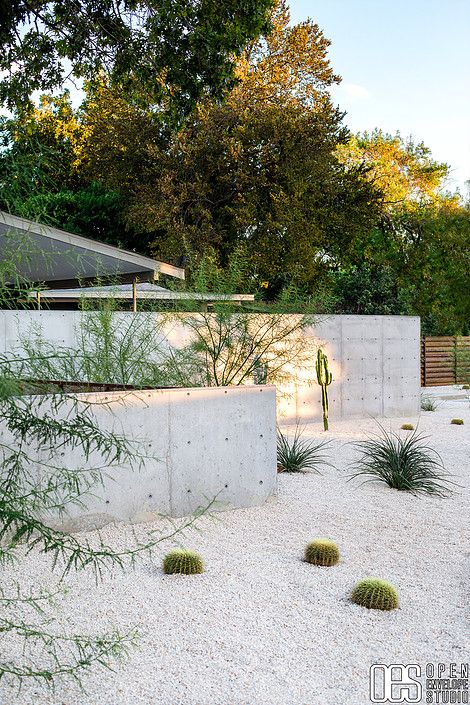 OES | Street view of concrete walls, crushed limestone xeriscape with succulents and native plants Crushed Quartz Landscape, White Gravel Backyard, Crushed Limestone Landscaping, Desert Plants In Pots, Denmark Landscape, Desert Landscaping Backyard, Flipping Homes, Open Envelope, Dry Gardens