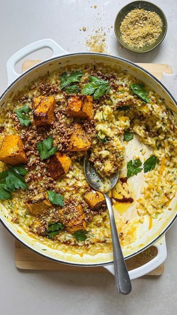 TOM WALTON 🌱 on Instagram: "This Roast Pumpkin & Super Seed Risotto recipe has become a household favourite & happens to be vegan 🌱 @pimp.my.salad Serves 4 Ingredients ¼ Kent pumpkin or half large butternut 5 tbsp extra virgin olive oil + extra to drizzle Salt, pepper 1 brown onion, diced 3 clove garlic, roughly chopped 2 cups Arborio rice 1 cup white wine 1.5l vegetable stock 1/3 cup Pimp my Salad Cashew parmesan 1/3 cup Pimp my Salad Super Seeds 2 handful parsley leaves Balsamic glaze to drizzle Method Preheat an oven to 220C. Remove the seeds from the pumpkin and set aside. Remove the skin then cut 2/3 of the pumpkin into 3cm pieces and grate the remaining pumpkin. Toss the dice pumpkin and its seeds on a baking tray with 2 tbsp of olive oil, salt and peppe Kent Pumpkin Recipes, Cashew Parmesan, Super Seeds, Parsley Leaves, Risotto Recipe, Arborio Rice, Roast Pumpkin, Risotto Recipes, Baking Tray