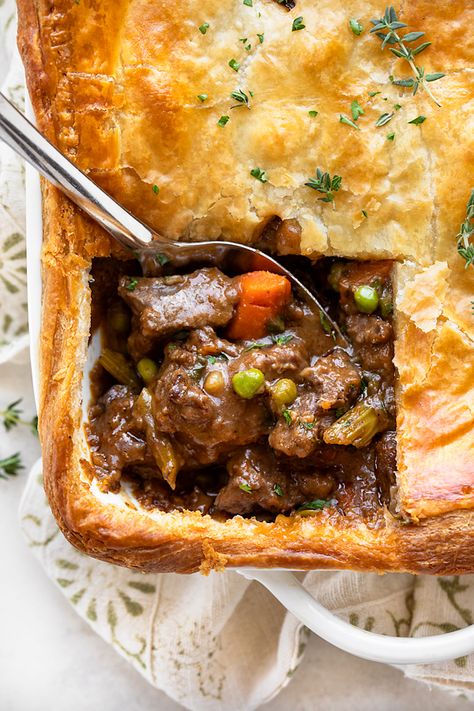 This beef pot pie features a hearty, slow-simmered beef stew filling topped with a flaky puff pastry crust, making for an extra cozy meal! | thecozyapron.com #beefpotpie #beefpotpierecipe #beefpotpierecipeeasy #beefpotpiewithpuffpastry #beefpotpiefilling Beef Pot Pie Recipe, Beef Pot Pie, Beef Pot Pies, Puff Pastry Crust, Pot Pies Recipes, Puff Pastry Recipes, Beef Recipes Easy, Beef Recipes For Dinner, Beef Dinner