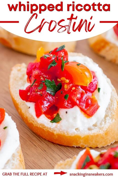 A whipped ricotta crostini with tomato and roasted red pepper topping on a wooden serving board. Baguette Appetizer, Ricotta Crostini, Crostini Recipe, Whipped Ricotta, Potato Bar, Crostini Recipes, Holiday Appetizer, Honey Roasted, Holiday Appetizers