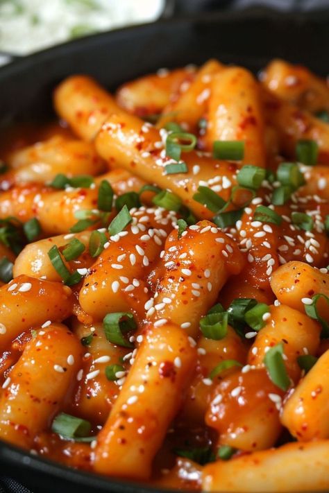 Korean Spicy Rice Cakes (Tteokbokki) are a delicious and nutritious choice for any mealtime! 🍲🌶️ Made with chewy rice cakes and spicy gochujang sauce, this dish is a delightful blend of bold flavors and satisfying texture. Quick to prepare and bursting with savory goodness, Korean Spicy Rice Cakes are perfect for a refreshing lunch or special treat. Indulge in this vibrant twist on a classic favorite today! 😋🌿 #Tteokbokki #KoreanCuisine #HealthyEating #SpicyFlavors Korean Yummy Food, Yummy Food Spicy, Tobboki Korean, Korean Spicy Food, Rice Cakes Korean, Tteokbokki Aesthetic, Food With Rice, Korean Spicy Rice Cake, Spicy Tteokbokki