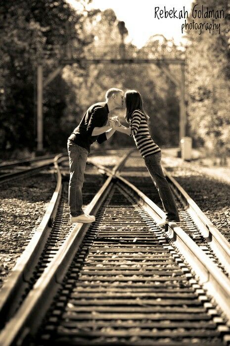 Train tracks # crossing #love #kiss #picture Train Track Poses, Railway Photoshoot, Railroad Photoshoot, Maturity Pictures, Train Tracks Photography, Track Pictures, Couple Kissing, Photography Images, Wedding Engagement Photos