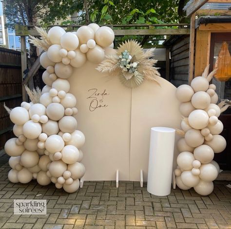 Neutral Tones 1st Birthday Backdrop And Balloon Set Up. Using Beige/Cream Sailboards, Balloon Garland, Vinyl Backdrop Personalisation, Cake Plinth, Pampas Grass Additions. The perfect first birthday backdrop. #1stbirthday #1stbirthdayparty #1stbirthdayideas #neutraldecor Cake Plinth, First Birthday Backdrop, 1st Birthday Backdrop, 18th Bday, Event Stylist, Birthday Garland, Balloon Backdrop, Vinyl Backdrops, Girl First Birthday