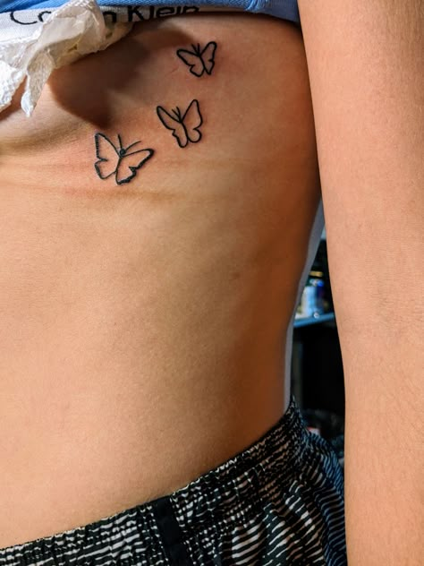 Three butterfly rib tattoo. Super simple and beautiful design. Small Rib Tattoos, Simple Butterfly Tattoo, Rib Tattoos For Women, Petit Tattoo, Cross Tattoos For Women, Butterfly Tattoos, Awesome Tattoos, Butterfly Tattoo Designs, Cute Tattoos For Women