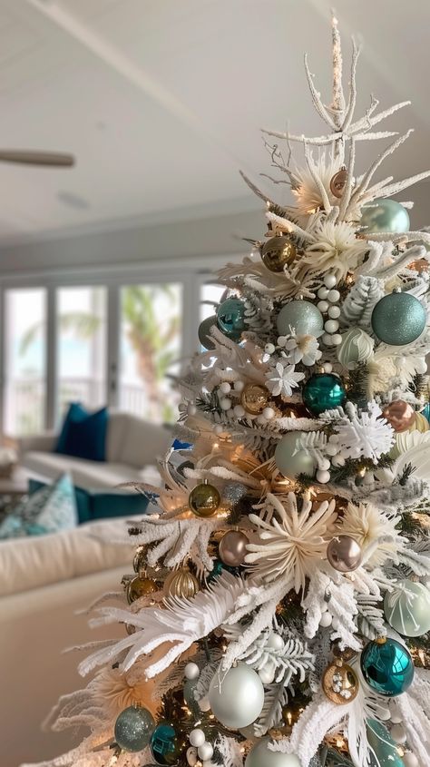 12 Stunning Christmas tree Themes {2024} - House On Austin Aqua Blue Christmas Tree, Aqua Christmas Tree Decor, Tiffany Christmas Tree, Turquoise Christmas Tree Ideas, Teal Christmas Tree Ideas, Peacock Christmas Tree Ideas, Beach Theme Christmas Tree Ideas, Coastal Christmas Tree Ideas, Themed Christmas Trees