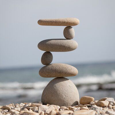 Rosecliff Heights Representing safety, hope, and friendship, cairn stones have been used by cultures around the globe for centuries. Made of real stones and a steel rod, each cairn garden stone used is selected for its unique and appealing aesthetic. Whether serving as a memorial stone or a directional marker, cairn stones add a sense of balance and calm to the hectic pace of daily life. These stones are stacked up high with natural beach pebbles and river rocks. Every single piece is hand-selec Ideas Para Decorar Jardines, Rock Cairn, Pagoda Garden, Garden Rock Art, Rock Sculpture, Art Pierre, River Stones, Pebble Stone, Memorial Stones