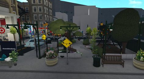 Bloxburg City Entrance, Bloxburg Town Ideas List, Flower Shop Bloxburg, Bloxburg Park, Bloxburg City Ideas, Bloxburg Nyc, Bloxburg Town Layout Small Plot, City Bloxburg, Simple House Exterior