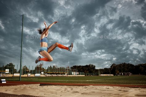 Female athlete performing a long jump during a competition by master1305. Female athlete performing a long jump during a competition at stadium. The jump, athlete, action, motion, sport, succ...#long, #jump, #competition, #Female Long Jump Aesthetic, Jump Aesthetic, Female Athlete, Triple Jump, Sport Portraits, Run Runner, Long Jump, High Jump, Sports Photography