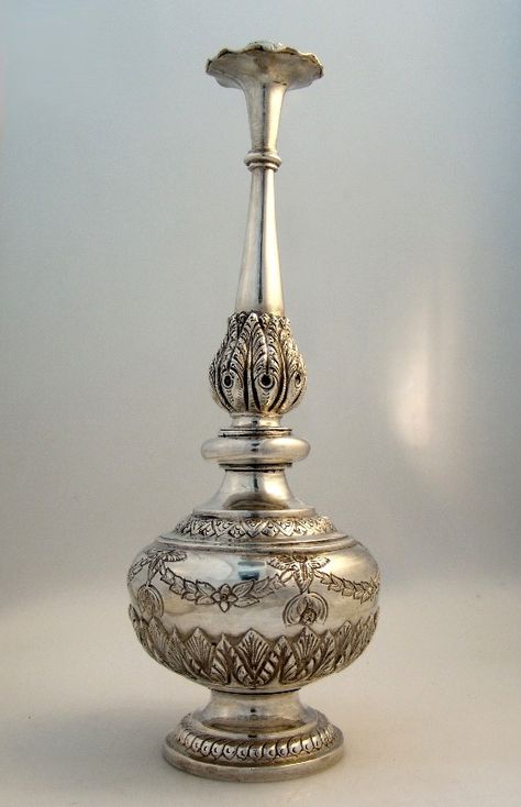 Sterling Silver Rose Water Shaker Colonial India 1850 (code: wb784 )  Exotic and rare rose water shaker c. 1850. Made in British Colonial India with stunning decorative embellishment and gorgeous peacock feather inspired repousse borders. Antique Showpieces, Ruby Jewelry Necklaces, Gold Wallpaper Phone, Colonial India, Bird Painting Acrylic, Indian Antiques, Rare Roses, Pooja Items, Temple Design For Home