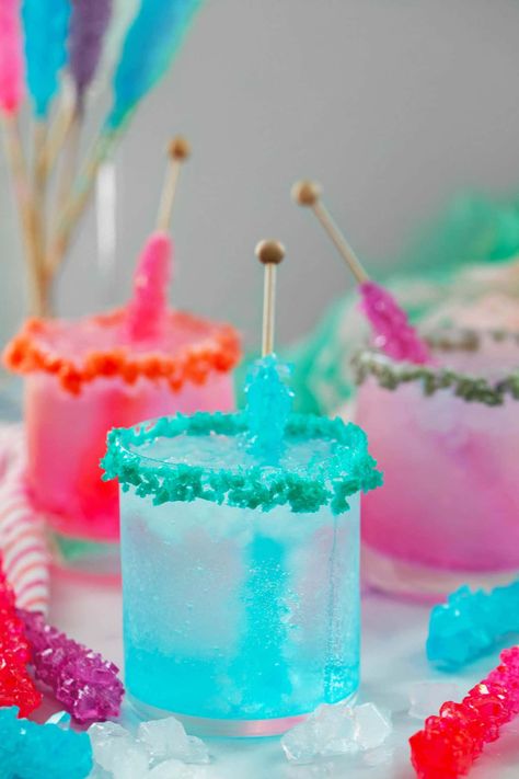 Rock Candy Cocktail -- These Rock Candy Cocktails are incredibly easy to make with just a few ingredients. The pretty drinks are simple vodka sodas with a rock candy stick stirred in for a little sweetness and fun color! Rock Candy Cocktail, Make Rock Candy, Candy Stick, Fun Drink Recipe, Best Summer Cocktails, Candy Cocktails, Candy Drinks, Colorful Drinks, Yummy Alcoholic Drinks