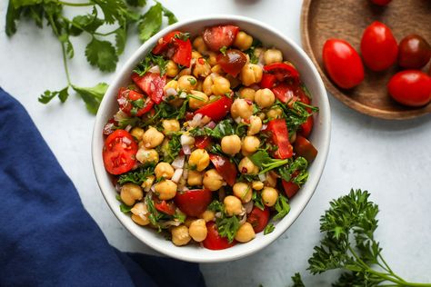 These marinated chickpeas are perfect as a light meal, side dish, or snack. Simply combine hearty chickpeas with juicy tomatoes and fresh herbs, and let it marinate in a tangy red wine vinaigrette. This recipe Marinated Chickpeas, Light Pasta, Red Wine Vinaigrette, 15 Minute Meals, Chickpea Recipes, Juicy Tomatoes, Salad Side Dishes, Week Meal Plan, Dessert For Dinner