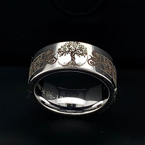 This truly beautiful Celtic Family Tree Tungsten Wedding Ring is more like a work of art than a piece of jewelry. The ring measures 9mm in width. The profile of the ring is flat with high polished texture. The inner part is rounded for Comfort Fit.Please confirm your finger size with the local jeweler before placing the order. This simple and elegant Unisex Wedding Ring can make a perfect Wedding Band, Anniversary Ring and Promise Ring for both Men and Women. * Metal Tungsten Carbide * Width 9mm Unique Mens Wedding Rings Vintage, Tree Of Life Ring Wedding Bands, Lord Of The Rings Wedding Band, Viking Wedding Rings, Black Tungsten Mens Rings, Viking Wedding Ring, Custom Wedding Ring, Mens Ring Designs, Cool Rings For Men