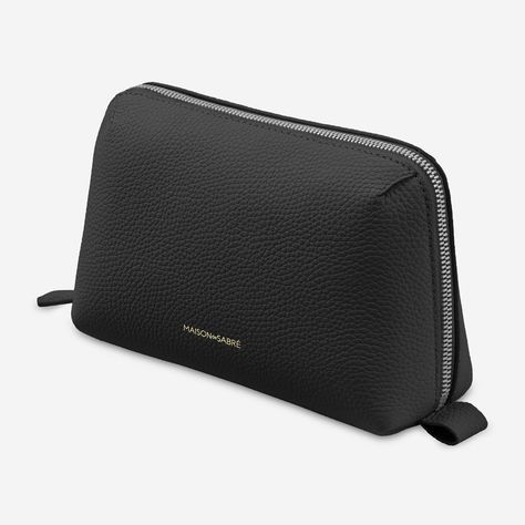 A minimalistic case to fit inside any bag or backpack and meticulously organise electronic accessories. The Tech Pouch is a plush, multi-compartment design crafted from full-grain pebbled leather and technical stretch fabric to safeguard cables, chargers, SD cards, AirPods and more within five purpose-built compartments. An internal zipped pouch secures smaller valuables while a striking clamshell silhouette and structured base ensures it stands forever upright, minimising surface occupancy and Tech Pouch, Tech Bag, Sustainable Leather, Hand Painted Leather, Blue Gift, Black Caviar, Painting Leather, Toiletry Bags, Wash Bags