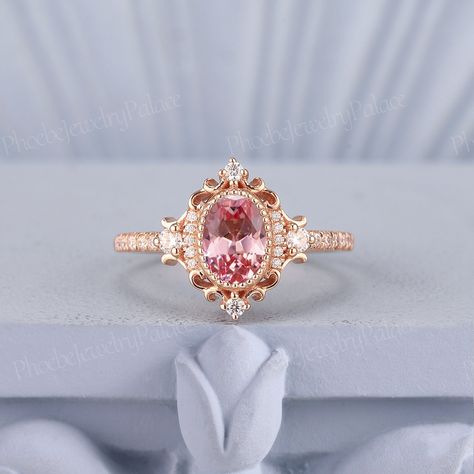 Vintage Peach Pink Sapphire Engagement Ring Oval Wedding Rings for Women Solid Gold Diamond Cluster Cocktail Ring Anniversary Handmade Gift PRODUCT SUMMARY Metal Type: yellow, white or rose solid 10k, 14k or 18k gold. Size: All sizes are available, contact me if they do not contain the size you want in the drop-down menu. ☪☪Engagement ring ⚜Center Stone - Lab Grown Peach Pink Sapphire Cut - Oval Size - 5x7mm ⚜Side Stone - Moissanite or Natural Diamond Cut - Round Weight - 0.21ct Clarity - SI-VS Oval Wedding Rings, Pink Wedding Ring, Sapphire Engagement Ring Oval, Peach Sapphire Rings, Pink Sapphire Engagement Ring, Oval Sapphire Engagement Ring, Pink Diamonds Engagement, Pink Diamond Engagement Ring, Pink Engagement Ring