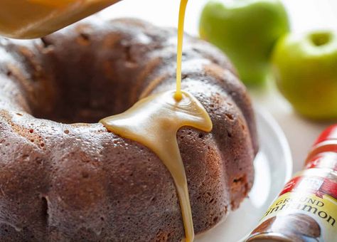 Super moist and loaded with apples and cinnamon, Cinnamon Apple Moonshine Cake is topped with a moonshine caramel glaze that sweetens the deal! Moonshine Cake, Pear Bundt Cake, Apple Moonshine, Pumpkin Pound Cake, Apple Bundt Cake, Cake With Caramel, Bundt Cake Recipe, I Am Baker, Caramel Glaze