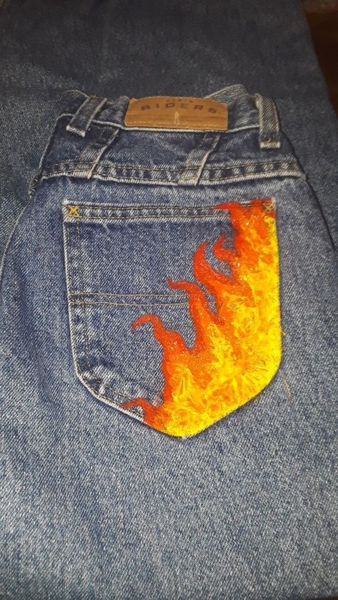 Fire Painting On Jeans, Acrylic Paint On Jeans, Writing On Jeans, Painted Baggy Jeans, Drawn On Jeans, Homecoming Jeans, Jean Painting, Jeans Painting, Stylish Jeans For Men