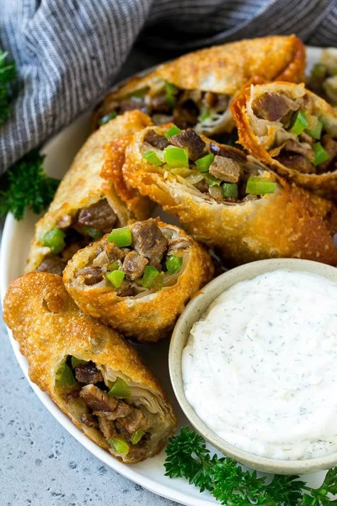 Philly Cheesesteak Egg Rolls Cheesesteak Appetizer, Steak Bits, Cheesesteak Eggrolls, Shaved Beef Recipe, Philly Cheesesteak Egg Rolls, Rolls Dinner, Steak Peppers, Crispy Cream, Steak And Cheese