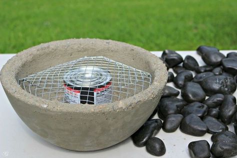 If you're looking to add a little flare to your outdoor space, this DIY concrete fire bowl will do the trick! Begin with a bag of quick setting concrete, water, two bowls - one bowl smaller than the other, non stick kitchen spray, mesh wire, chafing fuel and fire safe rocks. Spray the inside of the large bowl and outside of the small bowl. Mix the concrete until it is the consistency of peanut butter. Fill the large bowl 3/4 of the way full. Press the smaller bowl into the concre… Diy Fire Pit Ideas, Tabletop Fire Bowl, Diy Tabletop, Do It Yourself Decoration, Fire Pit Materials, Metal Fire Pit, Tabletop Firepit, Fire Pit Furniture, Diy Bowl