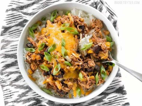 Slow Cooker Taco Chicken Bowls are the ultimate "set it and forget it" easy weeknight meal that the whole family will love. BudgetBytes.com Slow Cooker Taco Chicken, Slow Cooker Taco, Slow Cooker Chicken Fajitas, Chicken Taco Bowls, Taco Chicken, Chicken Cooker, Slow Cooker Chicken Tacos, Chicken Bowls, Budget Bytes