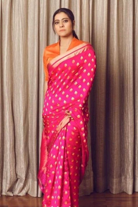 Pink banarasi saree : This six-yard beauty is a serene bollywood style saree that is skillfully made by Gold Zari Weaving in Pallu with Exclusive Dual Border Design. We have poured all the love into careful Weaved the banarasi silk saree for a wedding is paired with Contrast unstitched blouse fabric. Kajol Saree, Kajol Devgan, डिजाइनर कपड़े, Sari Blouse Designs, Indian Saree Blouses Designs, Saree Blouse Patterns, Saree Blouse Designs Latest, Trendy Blouse Designs, Orange Blouse