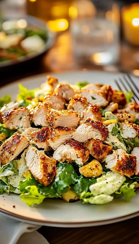 This Classic Chicken Caesar Salad Recipe offers a perfect blend of flavor with crispy romaine, juicy chicken, Parmesan cheese, and crunchy croutons, all tossed in a creamy Caesar dressing. It’s a refreshing yet filling dish, perfect for lunch or a light dinner. Easy to prepare and full of texture, it’s a must-try for salad lovers! Cesar Salad Recipe Chicken, Homemade Chicken Caesar Salad, Chicken Light Recipes, Chicken For Salads Recipe, Chicken Ceasar Recipes, Chicken Cesear Salad Dinner, Quick Light Dinner Ideas, Chicken For Salad, Cesar Salad Recipe