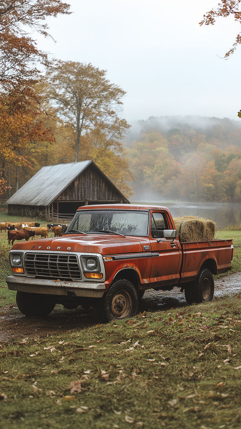 A vintage red Ford pickup truck parked in a field with hay bales in the back. There is a barn and a lake in the background, and the trees are turning red and orange. Vintage Truck Wallpaper Iphone, Fall Pickup Truck, Old Ford Trucks Vintage Wallpaper, Fall Truck Drawing, Vintage Trucks Aesthetic, Old Trucks Aesthetic, Pick Up Trucks 4x4, Fall Truck Wallpaper, Old Truck Interior Ideas