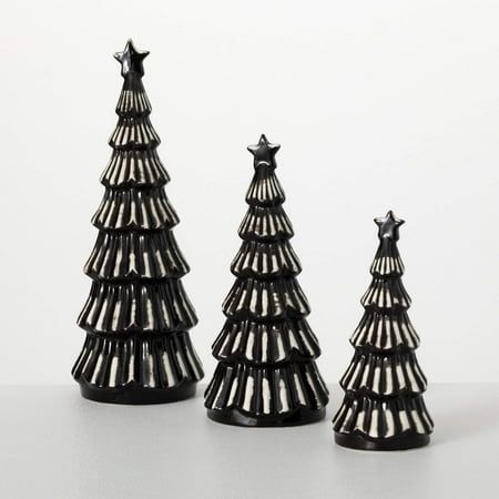 These three small modern black Christmas trees make a welcoming addition to your holiday decor, all without taking up too much space. In graduated sizes, they provide a cozy dose of Yuletide cheer without dominating the room. Perfect for those who enjoy a minimalist Christmas esthetic, their simple black coloring and diminutive size give them an understated elegance that will stand the test of time. Size: 4.75inchL x 4.75inchW x 13.25inchH, 4.5inchL x 4.5inchW x 10.25inchH, 3.25inchL x 3.25inchW x 8inchH. Black White Christmas Decor, Modern Boho Christmas, Black Christmas Decor, Small Tabletop Christmas Tree, Black And White Christmas Decor, Desktop Christmas Tree, Christmas Tree Store, Black Christmas Decorations, Christmas Aesthetics