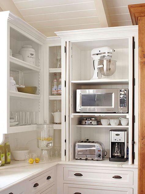 No more dragging out the toaster and coffee maker every morning! Add outlets inside a cabinet and group small appliances together: http://www.bhg.com/kitchen/storage/organization/storage-packed-cabinets-drawers/?socsrc=bhgpin022314smallappliancestation&page=20 Clever Kitchen Storage, Appliances Storage, Kitchen Storage Solutions, Kitchen Redo, Kitchen Remodel Idea, Pantry Organization, White Cabinets, Coffee Art, Small Appliances