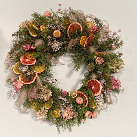 This completely compostabke wreath is composed of fresh pine, cedar and Douglas fir. With touches of preserved oranges, grapefruit and lemon. Dried hydrangeas, miscanthus, feather grass, eucalyptus, strawflower and gomphrena. Gomphrena Wreath, Strawflower Wreath, Christmas Dried Flowers, Dried Fruit Wreath, Dried Flower Wreaths Christmas, Dried Flower Wreath, Christmas Wreath Dried Flowers, Christmas Dried Flowers Wreath, Dried Goldenrod Wreath