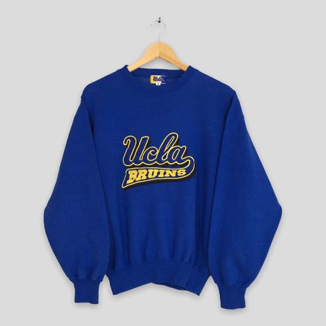 "Vintage 1990s UCLA Bruins Ncaa Sweatshirt Small University Of California Los Angeles Jumper Ucla California Crewneck Bruins Sweater Size S ▼ C O N D I T I O N : Good condition. No holes and stains. ▼ S I Z E (on tag) : Size S. To make sure if it FITS YOU, refer at the exact measurements. ▼ M E A S U R E M E N T S (flat) : ARMPIT (from pit to pit)                    : 21\" inches LENGTH (from back collar to hem) : 23\" inches WEIGHT                                                : 0.44 kg ▼ S H I P P I N G : DHL EXPRESS / EXPEDITED : 3-5 business day. **SHIP BY DHL EXPRESS, IT TAKES 3-5 BUSINESS DAYS TO ARRIVED. PLEASE LEAVE YOUR PHONE NUMBER ON THE NOTE WHEN PURCHASED.**  REF : Z-26032023-3375" Ucla Logo, Small University, Jumper Embroidery, Leroy Neiman, Fancy Stuff, Dream College, California Los Angeles, Vintage University, Ucla Bruins