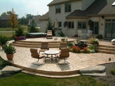 Multi-Tier Raised Stamped Concrete Patio...maybe our next house. Patio With Steps, Stamped Concrete Patio Ideas, Concrete Patio Ideas, Patio Stairs, Large Backyard Landscaping, Cement Patio, Concrete Patio Designs, Raised Patio, Concrete Patios