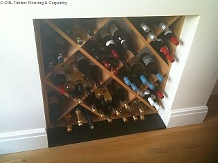 Wine Rack Fireplace, Wine Rack In Fireplace, Fireplace Wine Storage, Fireplace Wine Rack, Wine Rack Dining Room, Alcove Wine Rack, Above Cupboard Wine Rack, Unused Fireplace Ideas, Scaffold Board Wine Rack