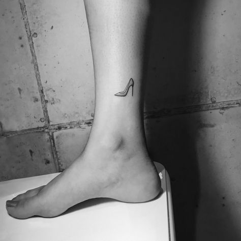 shoe by peterlaeviv . . . . #shoe #shoetattoo #heels #linework #smalltattoo #microtattoo #drawing #minimalism #simplicity #lineworktattoo #sketch #ankletattoo #girl #girltattoo #ankle #highheels #minimal #minimaltattoo #feminine #womantattoo #femininetattoo #tattooing #sketch #tattooartist #artist #tattooer #tattoos #inked #tattooprovocateur #ink #laeviv #tattoo #darkartists #blackworkers High Heel Tattoos, Boxing Tattoos, Heel Tattoos, Piercing Inspiration, Shoe Tattoos, Cute Tats, Anklet Tattoos, Chinese Tattoo, Beautiful Tattoo