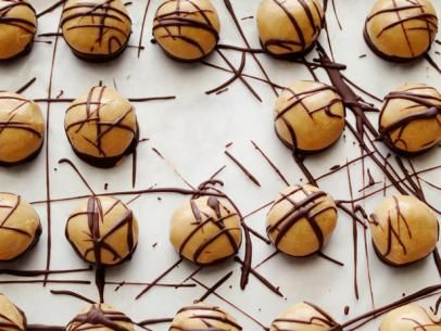 Frozen Peanut Butter Bites Recipe | The Neelys | Food Network Frozen Peanut Butter, Butter Bites, Peanut Butter Bites, Butter Balls, Peanut Butter Balls, Creamy Peanut Butter, Frozen Desserts, Frozen Treats, Sweets Treats