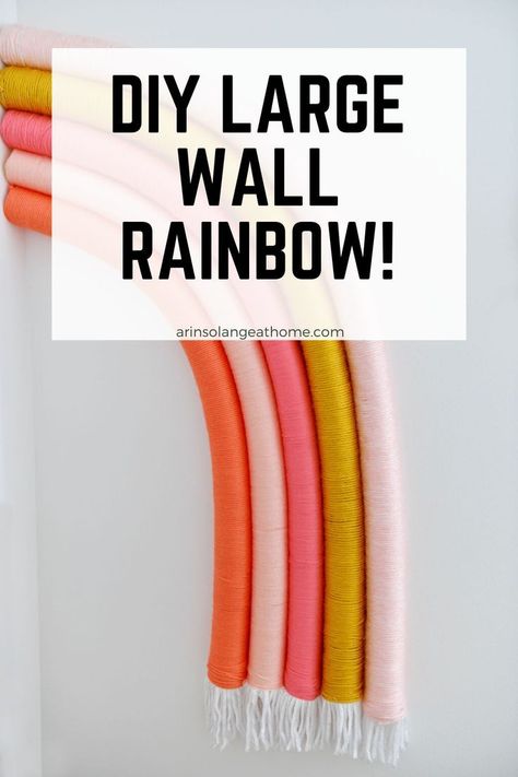 Check out this tutorial for a DIY Large wall rainbow art! This creates a beautiful aesthetic in a bedroom or nursery. Step by step instructions for how to create this large wall art on a budget using pool noodles and yarn! Diy Rainbow Wall Hanging Pool Noodle, Diy Big Wall Decor, Girls Room Diy Decor, Rainbow Wall Art Diy, Pool Noodle Rainbow, Diy Rainbow Decorations, Autumn Bed, Wall Art On A Budget, Nursery On A Budget