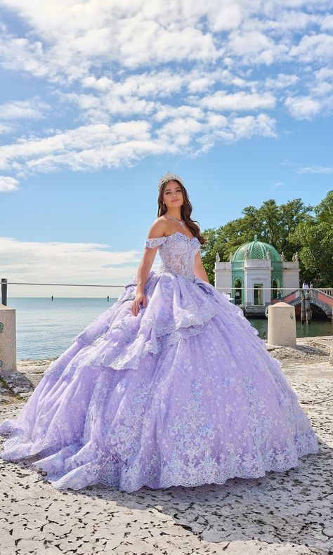 Pastel off the shoulder quinceanera a-line ball gown with layered skirt and lace embroidered flowers. Moda 2000 Quinceanera Dresses, Light Purple Quinceanera Dresses, Rapunzel Quinceanera Theme, Quince Dresses Purple, Cotillion Dresses, Purple Quince, Purple Quinceanera Dresses, Quinceanera Themes Dresses, Gown Silhouette