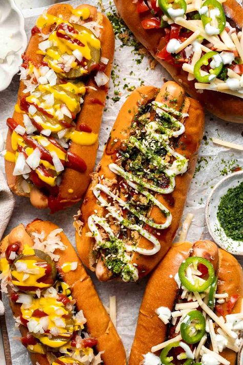 Juicy and delicious Gourmet Hot Dogs loaded with a variety of toppings will take your next backyard BBQ or potluck to a whole new level. Try them all! | aheadofthyme.com Fancy Hot Dogs Ideas, Gourmet Hotdogs Recipes, Loaded Hotdogs, Gourmet Hot Dog Bar, Hot Dog Toppings Ideas, Fancy Hot Dogs, Gourmet Hot Dogs Toppings, Hot Dog Photography, Hot Dog Gourmet