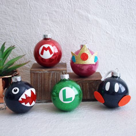 Fun Super Mario themed Holiday Ornaments Diy Nerdy Christmas Ornaments, Super Mario Gift Ideas Diy, Diy Super Mario Christmas Ornaments, Video Game Ornaments, Mario Brothers Christmas Tree, Diy Mario Ornaments, Marvel Ornaments Diy, Nintendo Christmas Tree, Super Mario Ornaments Diy