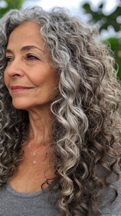 Sleek Curly Hairstyles for Women Over 50 for Natural Gray Curly Hair 🍃 Irish Curly Hair, Curly Haircuts For Women Over 50, Graying Hair Highlights Aging Gracefully, Over 50 Long Hairstyles, Sleek Curly Hairstyles, Going Gray Naturally, Over 50 Curly Hairstyles, Long Gray Hair Over 50, Curly Silver Hair