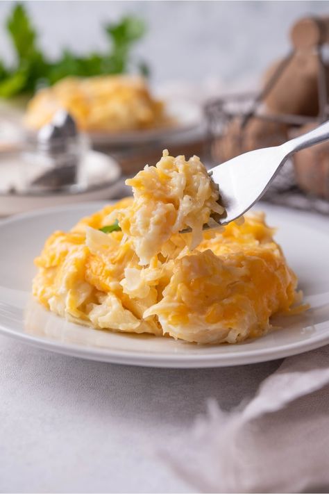 EASY Crockpot Cheesy Potatoes Recipe (Made With 5 Ingredients) Crockpot Cheesy Potatoes Hashbrowns, Crockpot Cheesy Potatoes, Cheesy Potatoes With Hashbrowns, Southern Meatloaf, Cheesy Potatoes Crock Pot, Cheesy Potatoes Recipe, Crock Pot Potatoes, Shredded Potatoes, Creamy Chicken Soup