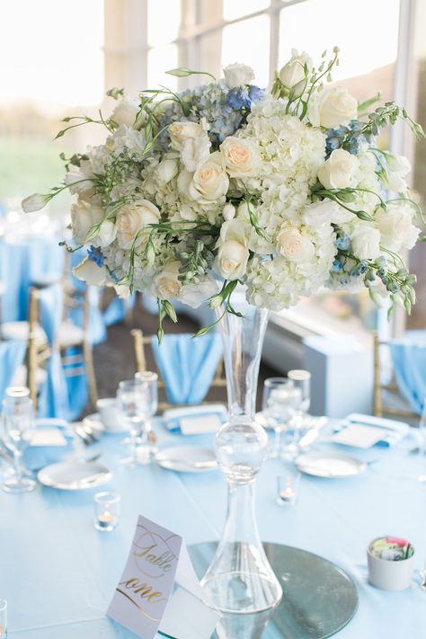 Blue and White Golf Course Wedding Tall Centerpiece with Clear Trumpet Vase | Event Planning, Styling & Design: Manna Sun Events | www.mannasunevents.com | Photo: Olivia Richards Photography Elevated Floral Centerpieces White, Trumpet Vases Centerpieces, Blue And White Tall Floral Arrangements, Clear Trumpet Vase Tall Centerpiece, Trumpet Vase Centerpiece Wedding, Flower Centerpieces Blue, Blue Arrangements, Trumpet Vase Centerpiece, Flowers Installation