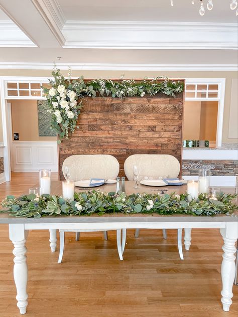 Sweetheart table garland with wooden backdrop adorned with flowers & greenery. Sweetheart Table Wood Backdrop, Sweetheart Backdrop, Sweetheart Table Wedding Backdrop, Sweetheart Table Candles, Sweetheart Table Backdrop, Brides Table, Wooden Backdrops, Table Garland, Sweetheart Table Wedding