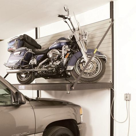 One of the major reasons buyers back away from a motorcycle purchase is that they’d have to park one of their cars outside to leave space for the bike. Motorcycle Storage Garage, Hd Fatboy, Bike Lift, Motorcycle Storage, Garage Lift, Garage Workshop Organization, Garage Tool Organization, Garage Storage Solutions, Garage Organize